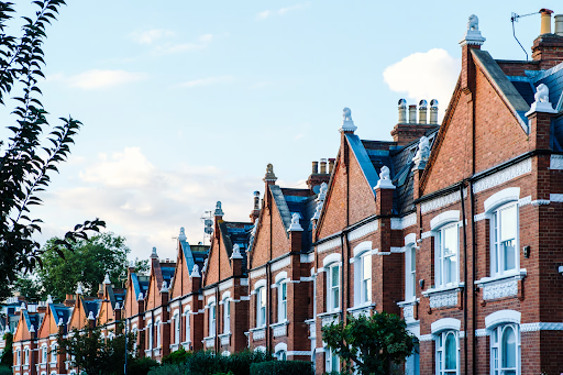 A row of terraced homes representing social housing properties managed by housing organisations.