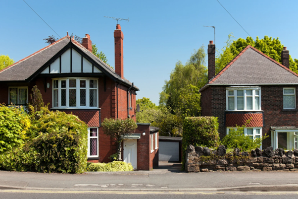 Row of typical English houses representing social housing software providers managing housing systems.