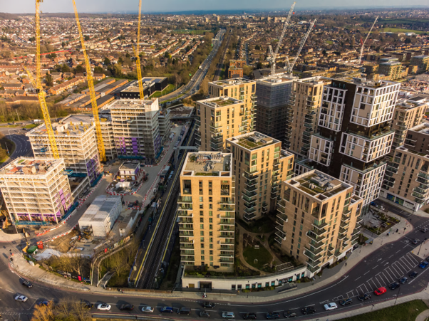 A large residential development under construction, representing social housing requirements and compliance with Awaab's Law.
